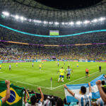 FIFA World Cup Stadium Night Match Scaled image of a vibrant soccer game with fans and players, perfect for sports blogs and event promotions, transparent background PNG.