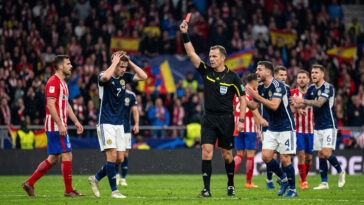 Referee Showing Red Card Football Scaled image of a referee issuing a red card in a match, perfect for sports analysis and articles, transparent background PNG.