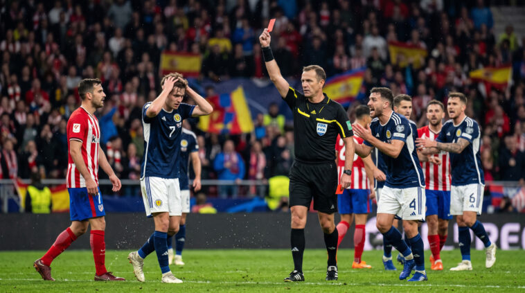 Referee Showing Red Card Football Scaled image of a referee issuing a red card in a match, perfect for sports analysis and articles, transparent background PNG.